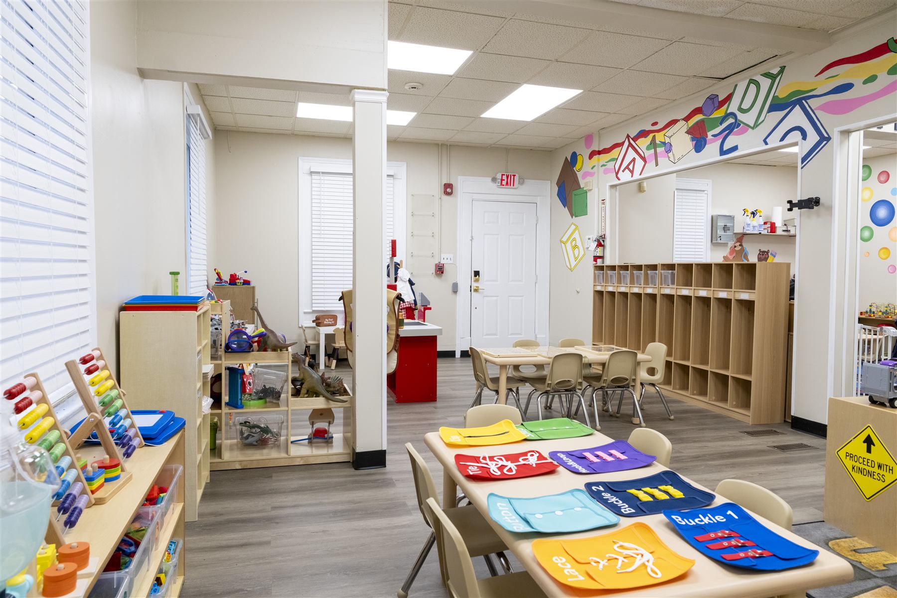 Preschool classroom with learning centers and cubbies