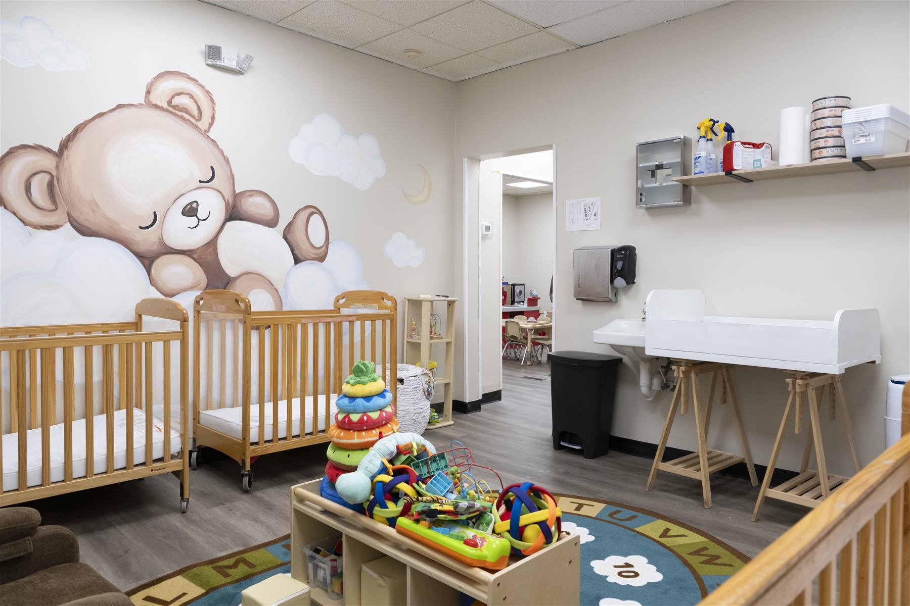 Nursery with sleeping teddy bear mural